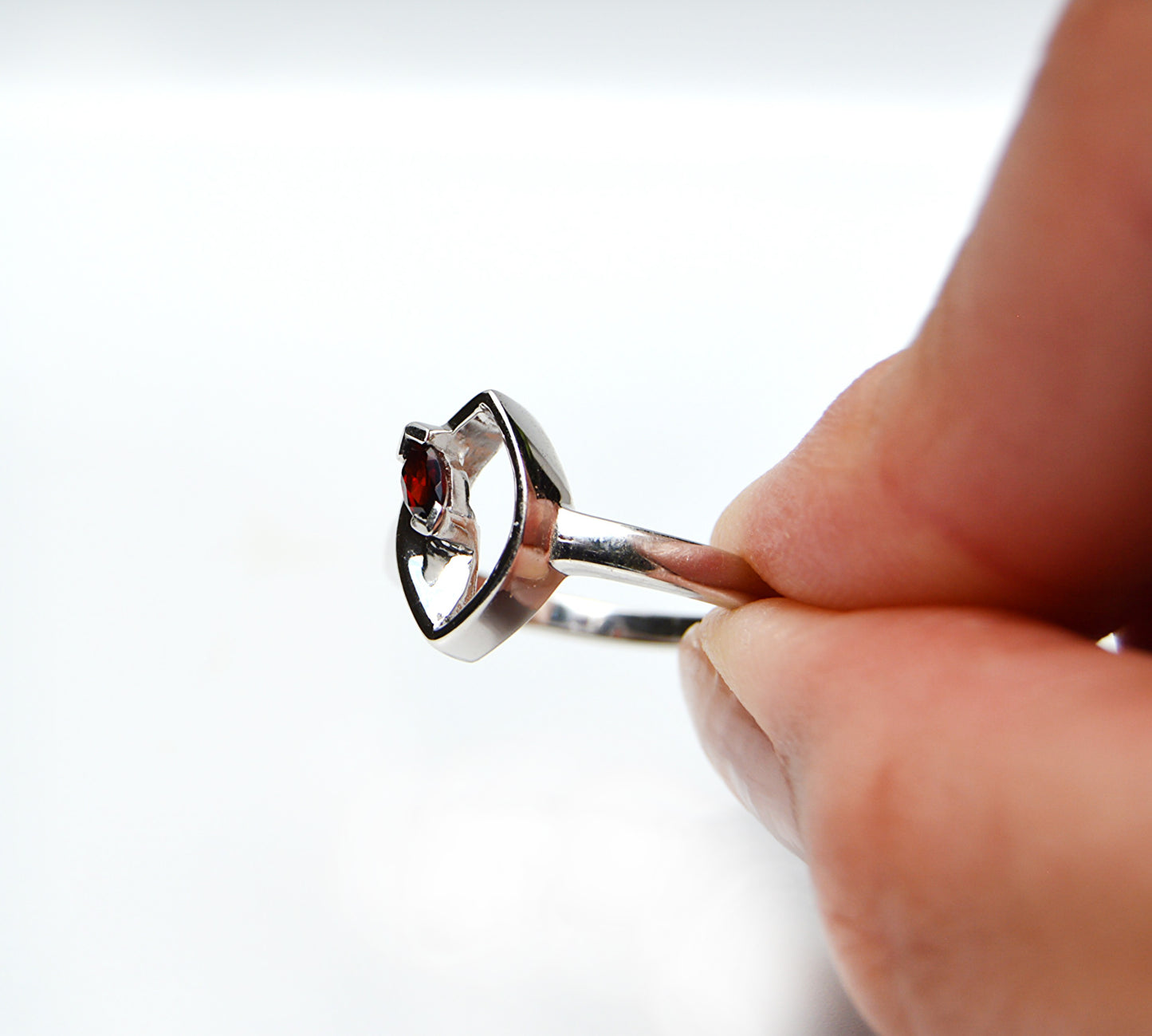 JeniMarie Jewelry with a rare and unique garnet ring in sterling silver with a high polish and comfort and.