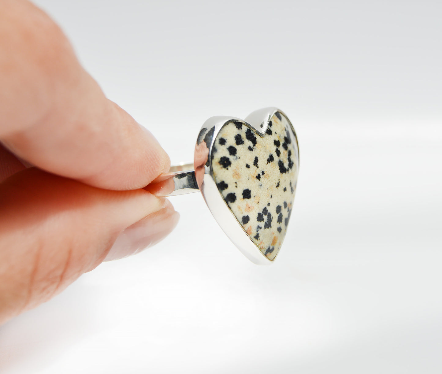 JeniMarie Jewelry with a statement ring with a dalmatian jasper stone shaped like a heart and set in sterling silver for a high shine and polish.