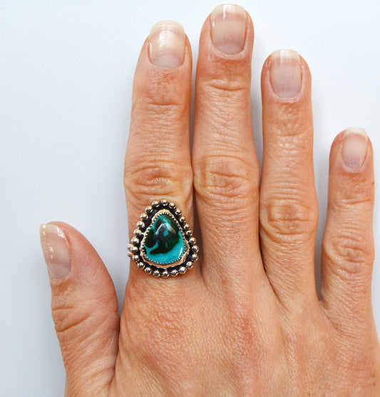 Unique and custom ring using a malaholla stone and using a fine silver bezel and sterling silver band.