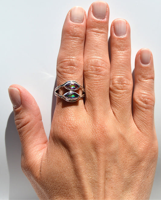 JeniMarie with a rare and unique fun ring featuring two mystic topaz stones. size 9 and with a comfort band.