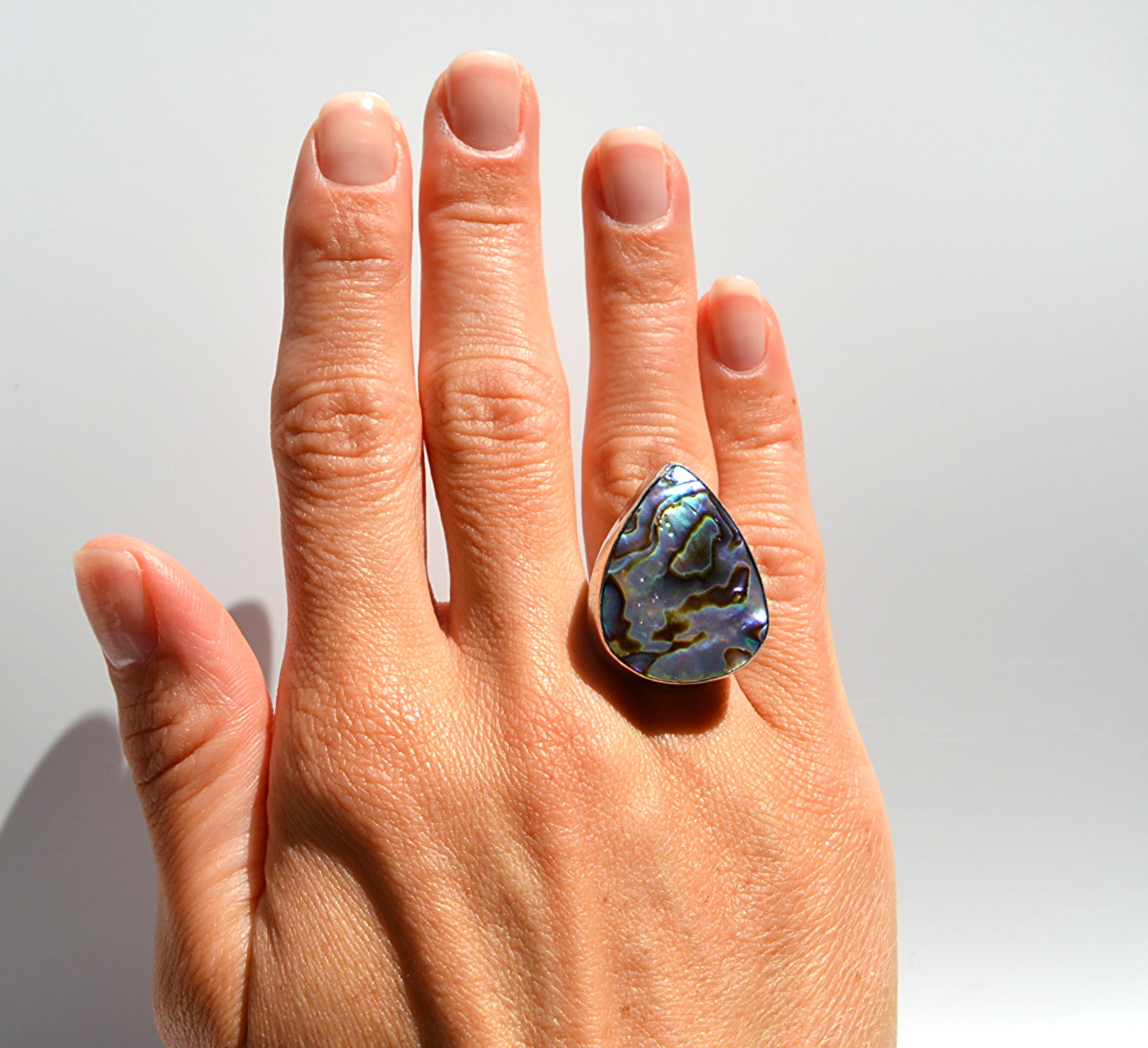 JeniMarie Jewelry with a rare and one of a kind abalone statement ring set in sterling silver for a high polish.