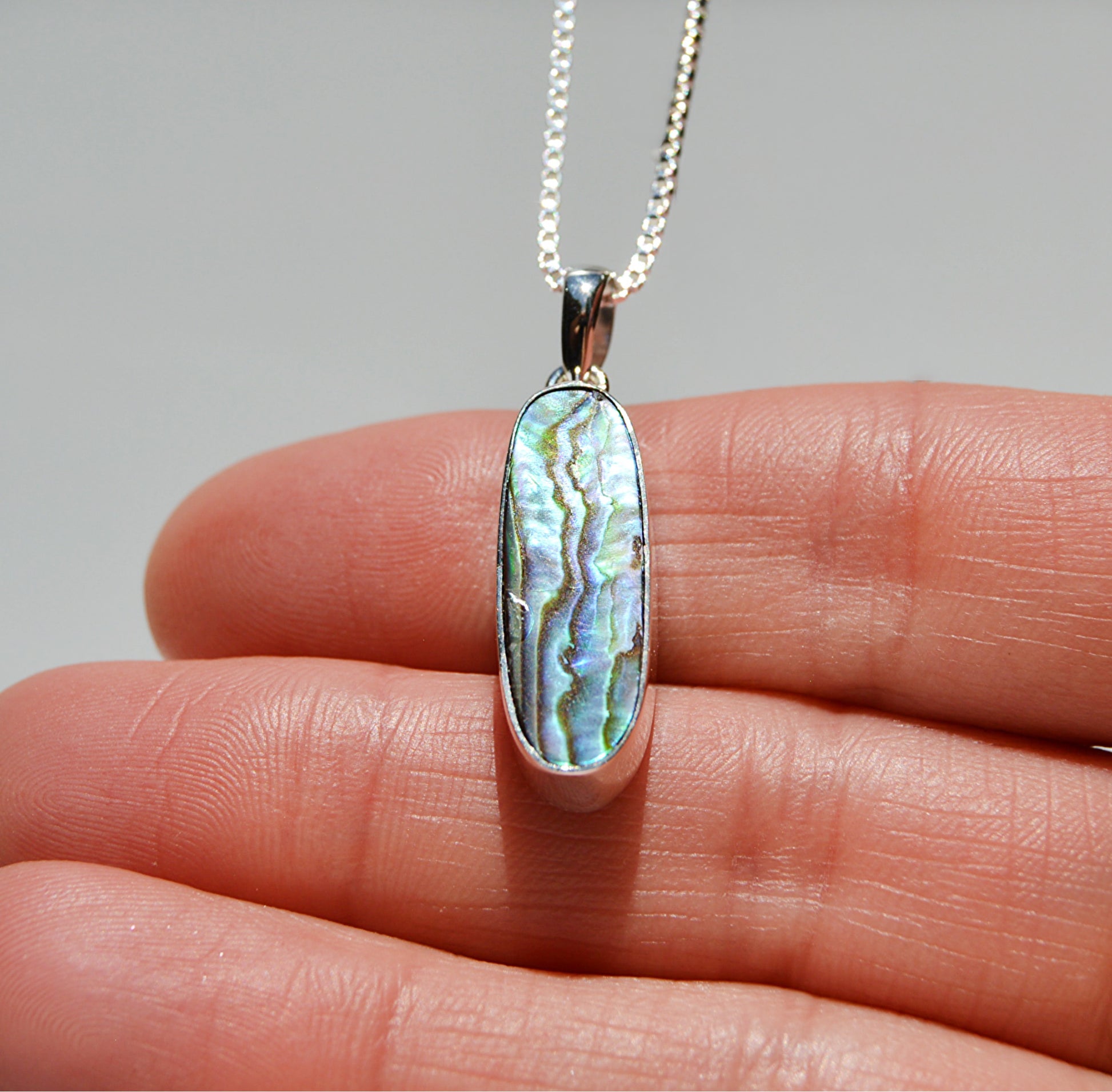 JeniMarie Jewelry with a large and rare oblong abalone pendant set in sterling silver. 