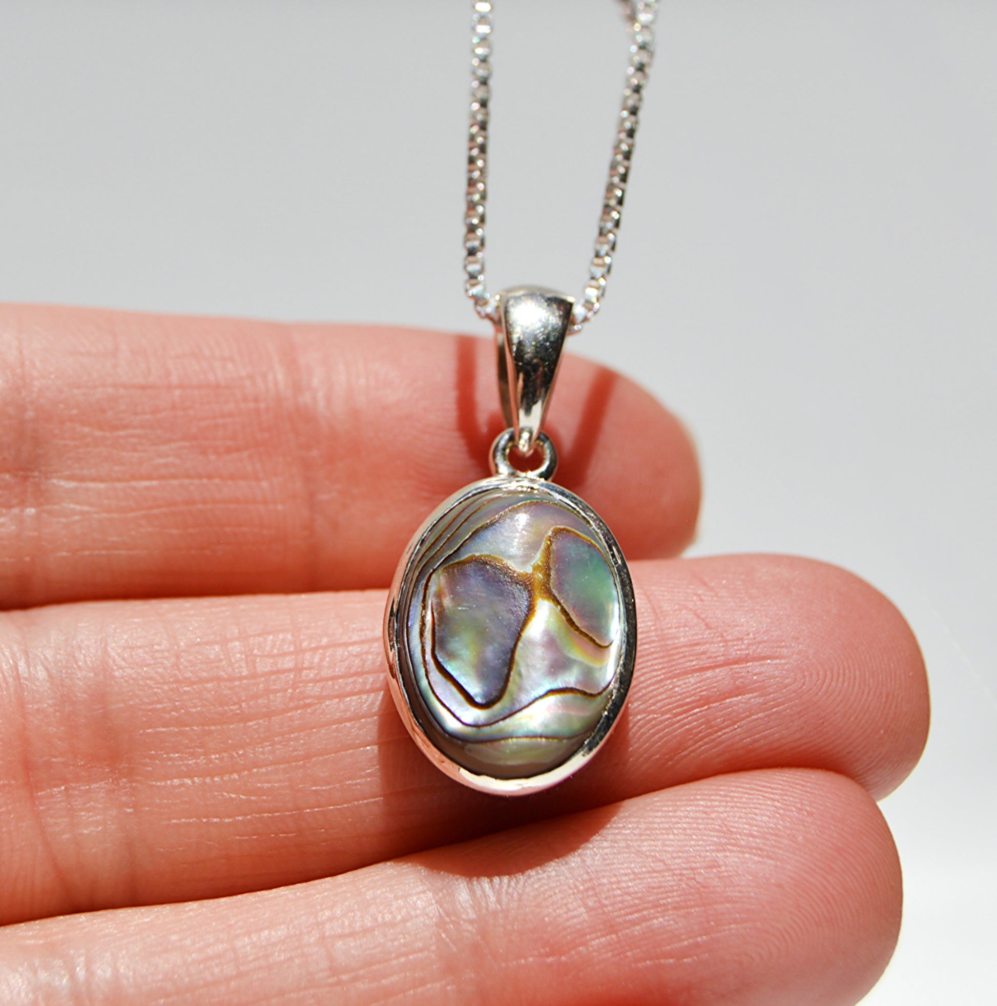 JeniMarie Jewelry with a abalone pendant and 18 inch box chain set in sterling silver. 