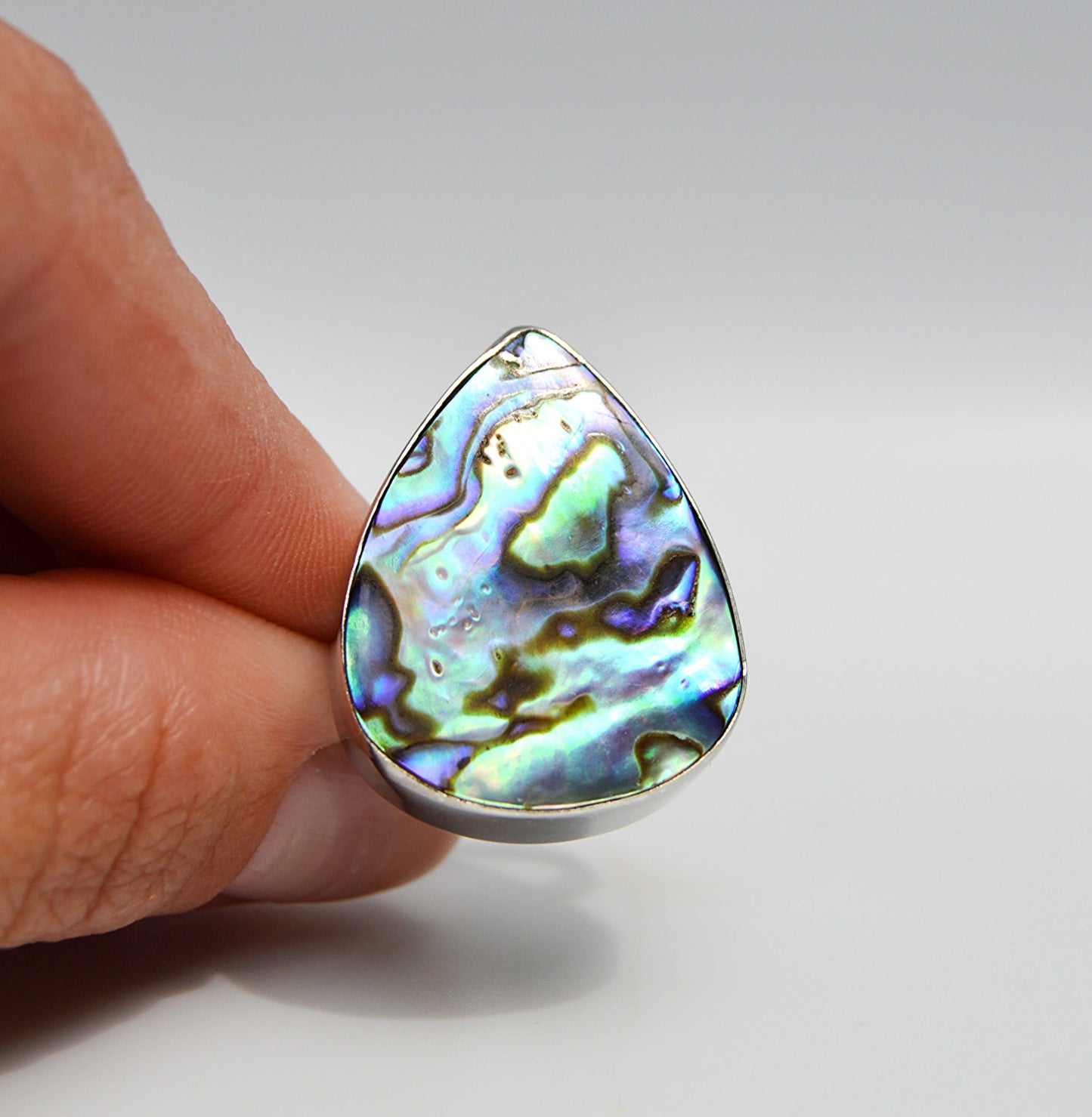 JeniMarie Jewelry with a large and rare abalone ring set in sterling silver. 