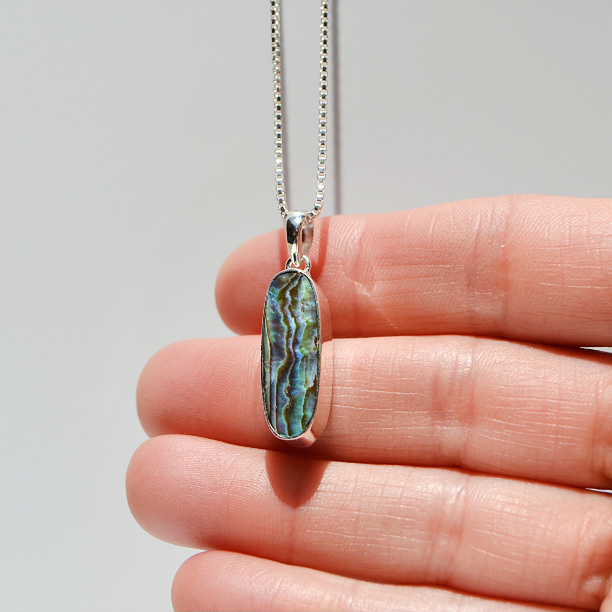JeniMarie Jewelry with  handmade abalone pendant along with a 18 inch box chain all in sterling silver. 