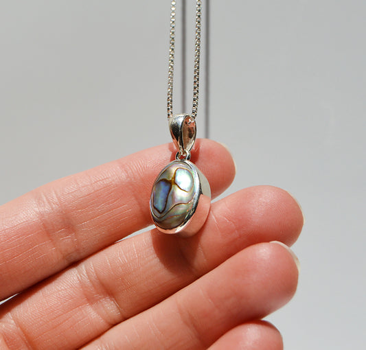 JeniMarie Jewelry with a rare and unique fun abalone pendant set in sterling silver with a 18 inch box chain to complete the look. 