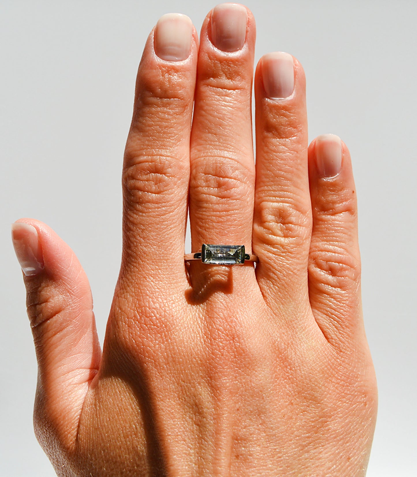 JeniMarie Jewelry with a large green amethyst stone set in sterling silver offered with a comfort band. 