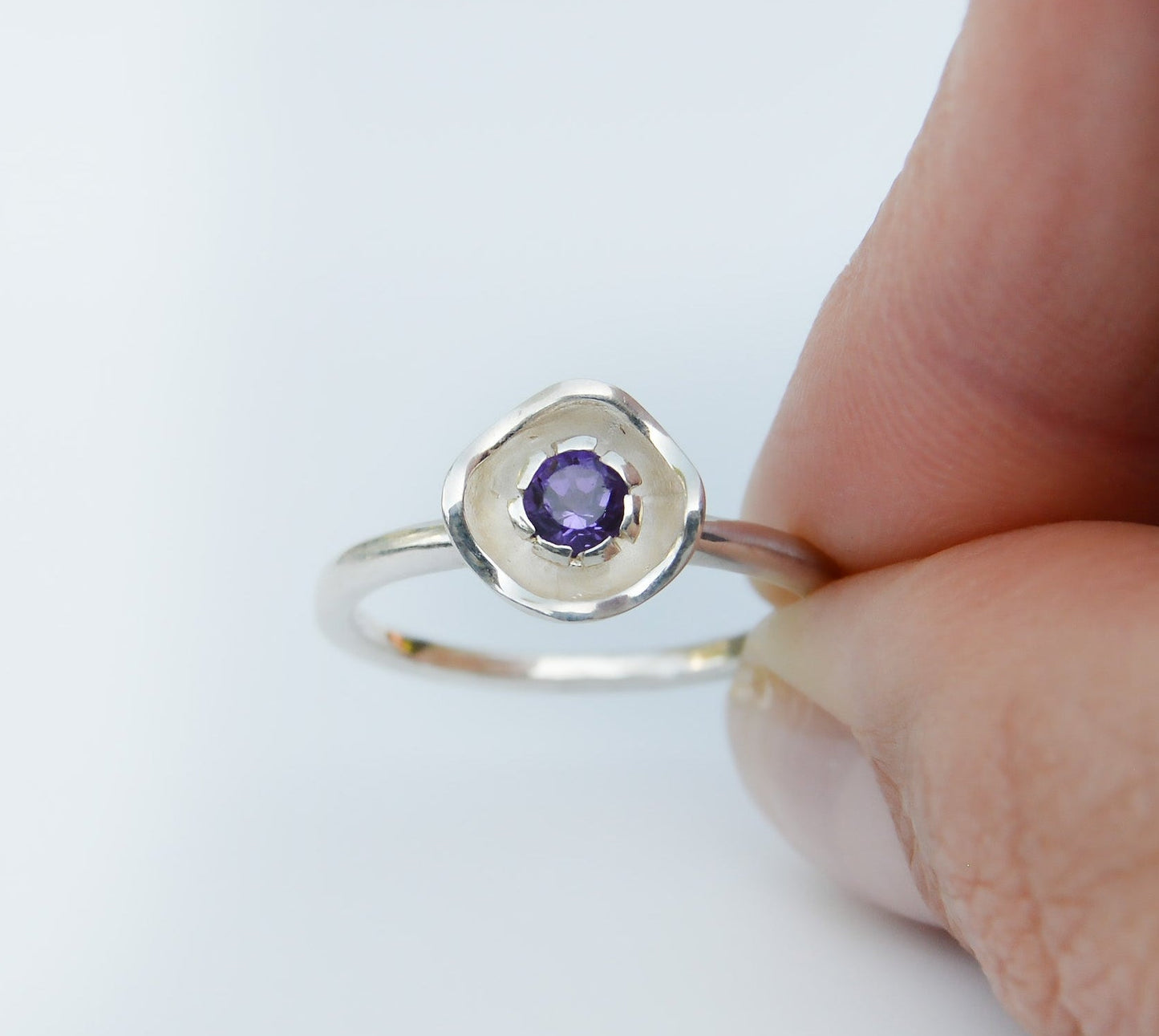 JeniMarie Jewelry with a fun amethyst ring looking like a flower, set in sterling silver. 