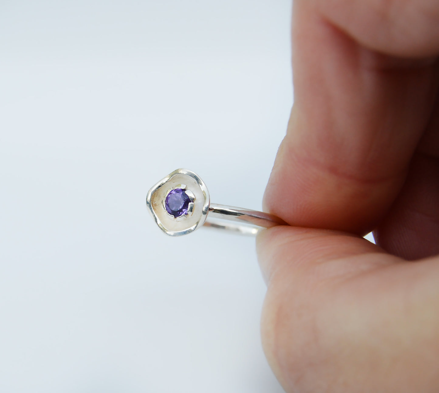 JeniMarie Jewelry with a beautiful amethyst flower ring set in sterling silver and hand polished for a high shine. 
