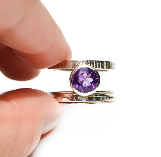 JeniMarie Jewelry with a stunning amethyst spinner ring with a textured band.