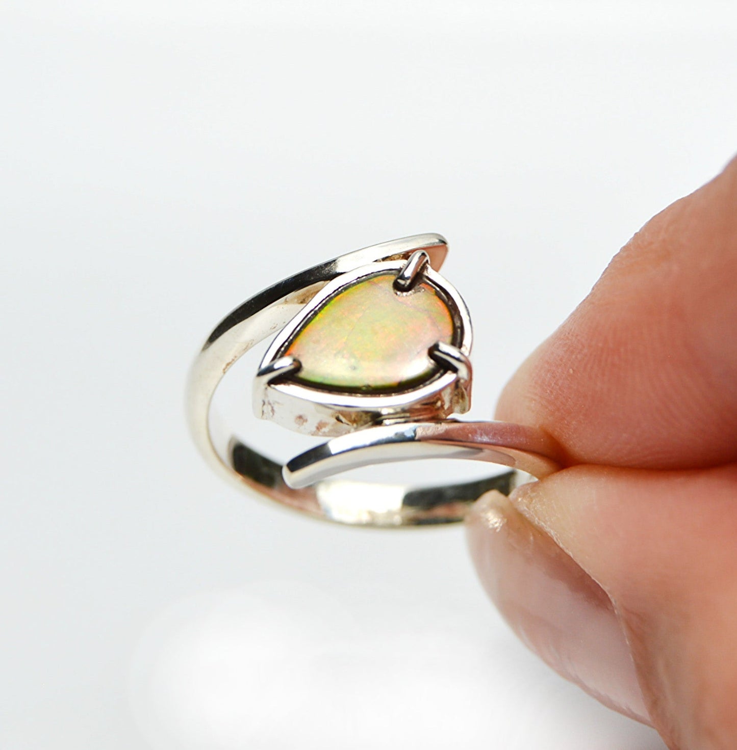 JeniMarie Jewelry with a handmade ammolite ring set in sterling silver. 