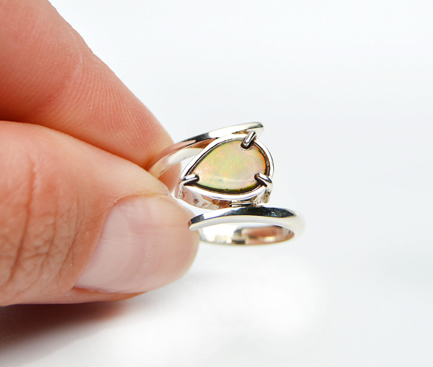 JeniMaire Jewelry presents a one of a kind piece with sterling silver and ammolite. 