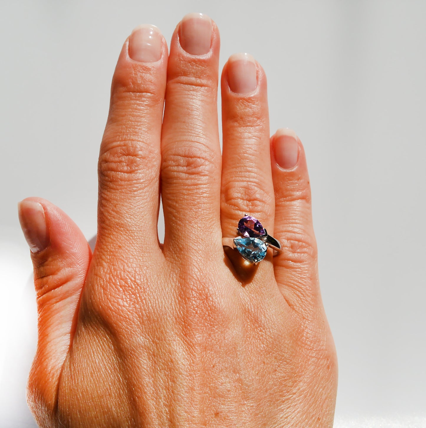 JeniMarie Jewelry with a beautiful dual stone ring featuring a blue topaz and purple amethyst prong set ring. 