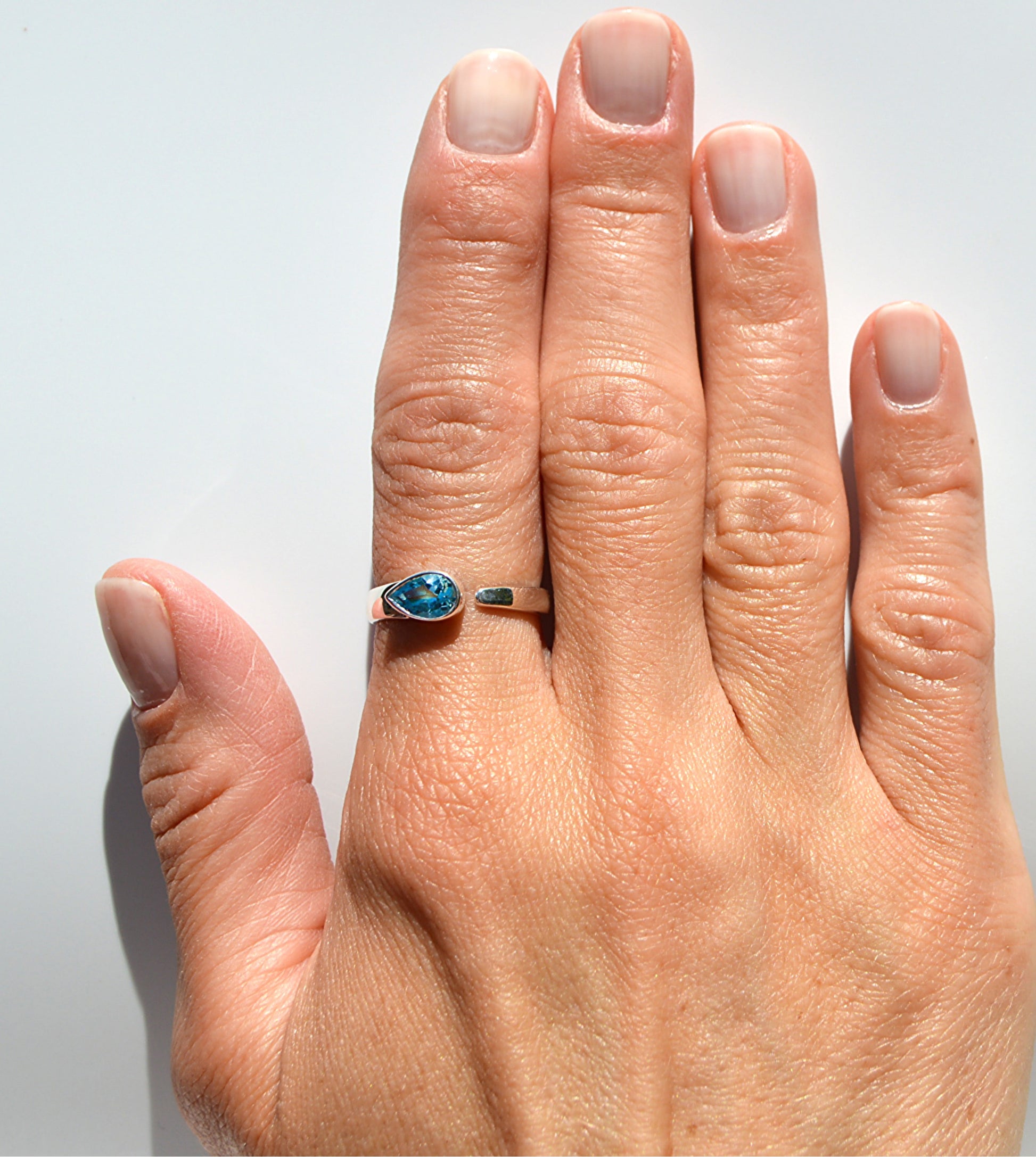 JeniMarie Jewelry has a blue topaz ring set in sterling silver making it hypoallergenic. 