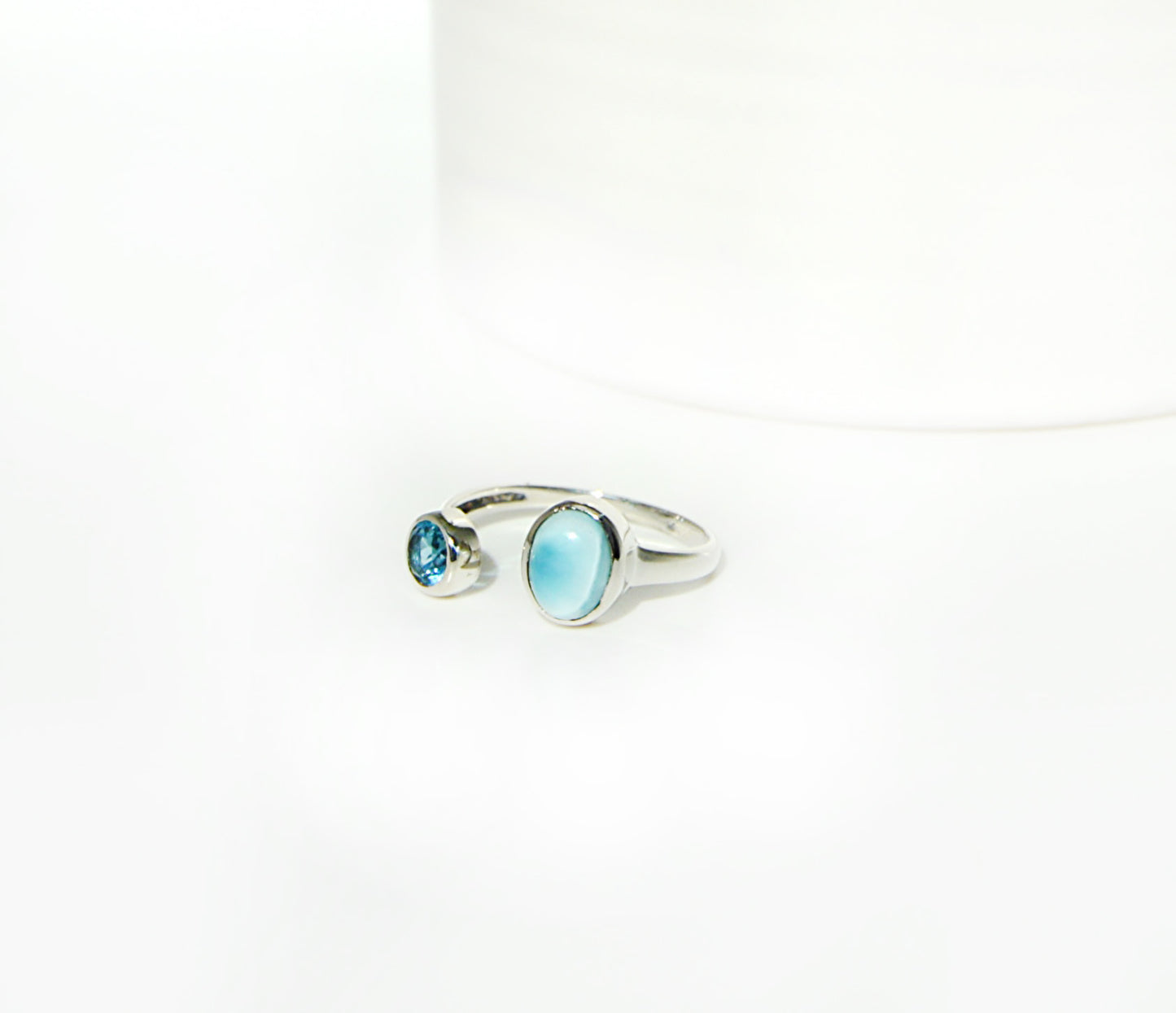 Sterling silver handset stones using blue topaz and a blue larimar stone size 9 ring using .925 sterling silver. 