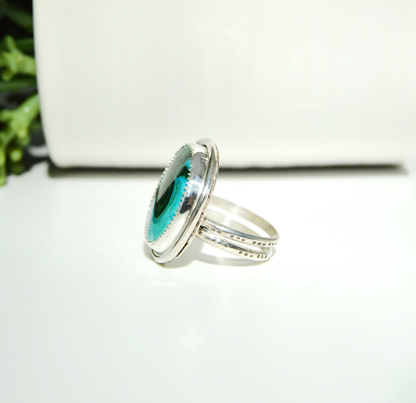 Large round Chrysocolla handset stone using a textured fine silver bezel and a dotted textured double band ring. One of a kind. 