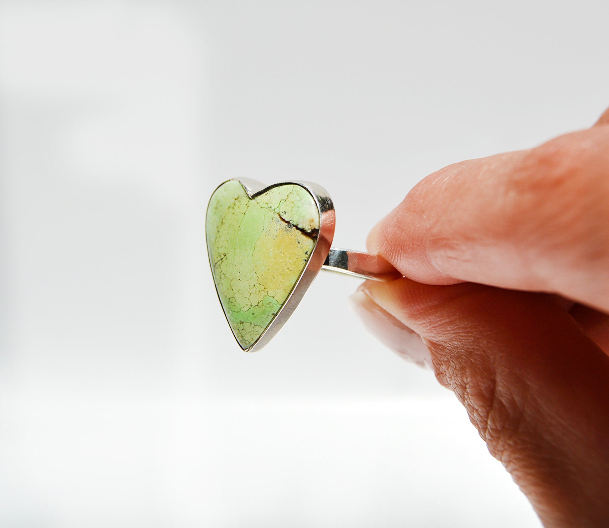 ring by JeniMarie Jewelry using a lemon stone with a heart shape all set in sterling silver. 