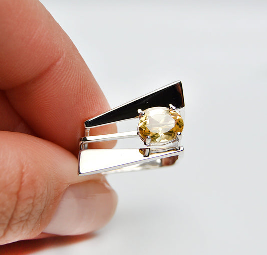JeniMarie Jewelry with a statement ring showcasing a yellow citrine stone prong set on a multi band ring set in sterling silver. 