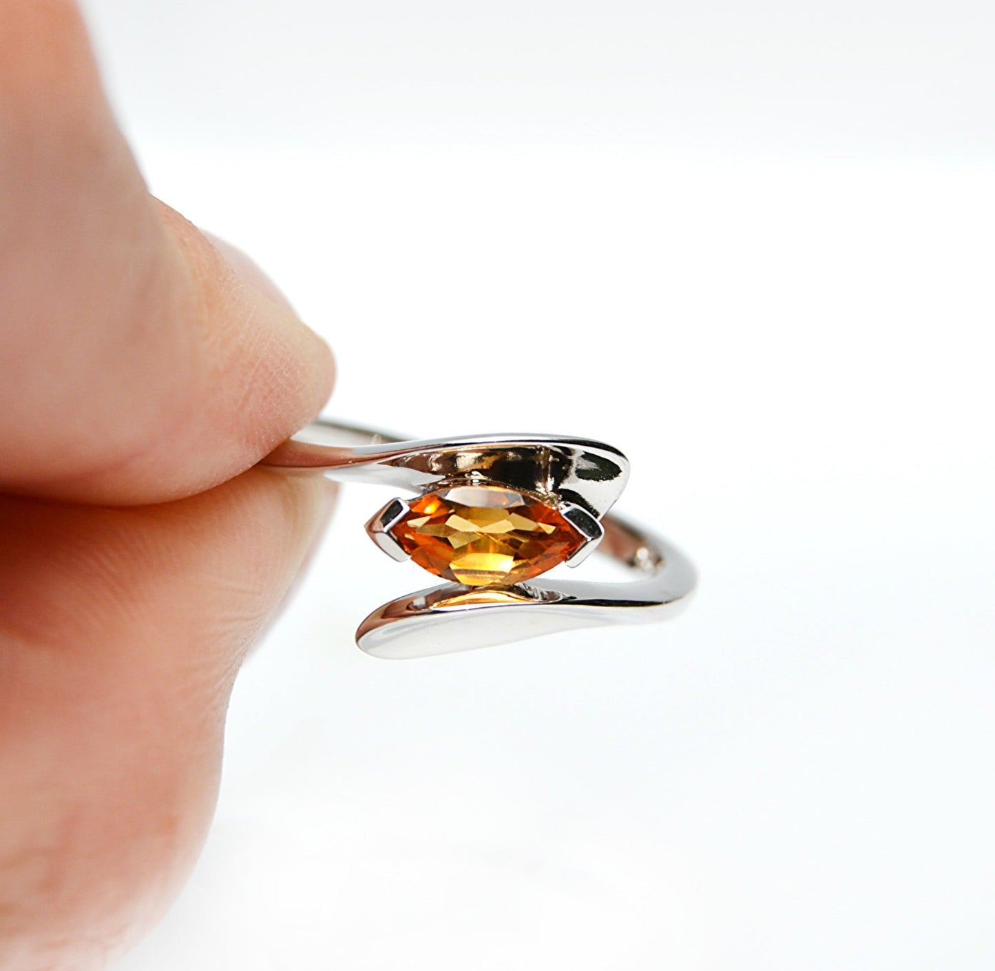 JeniMarie Jewelry with a statement ring using a citrine stone and set in sterling silver. 