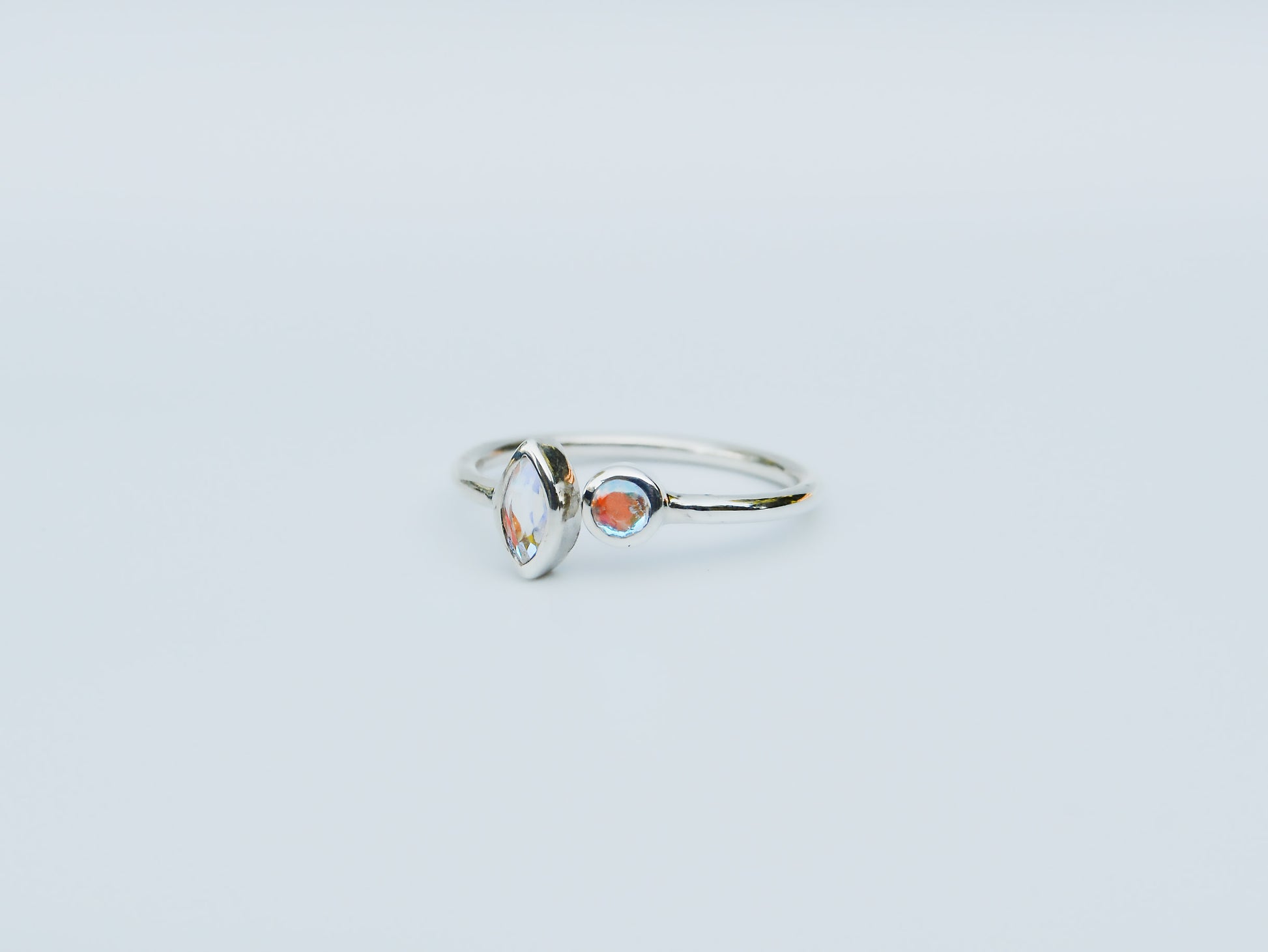 JeniMarie Jewelry with a stunning two stone different shapes, open band sterling silver ring. 