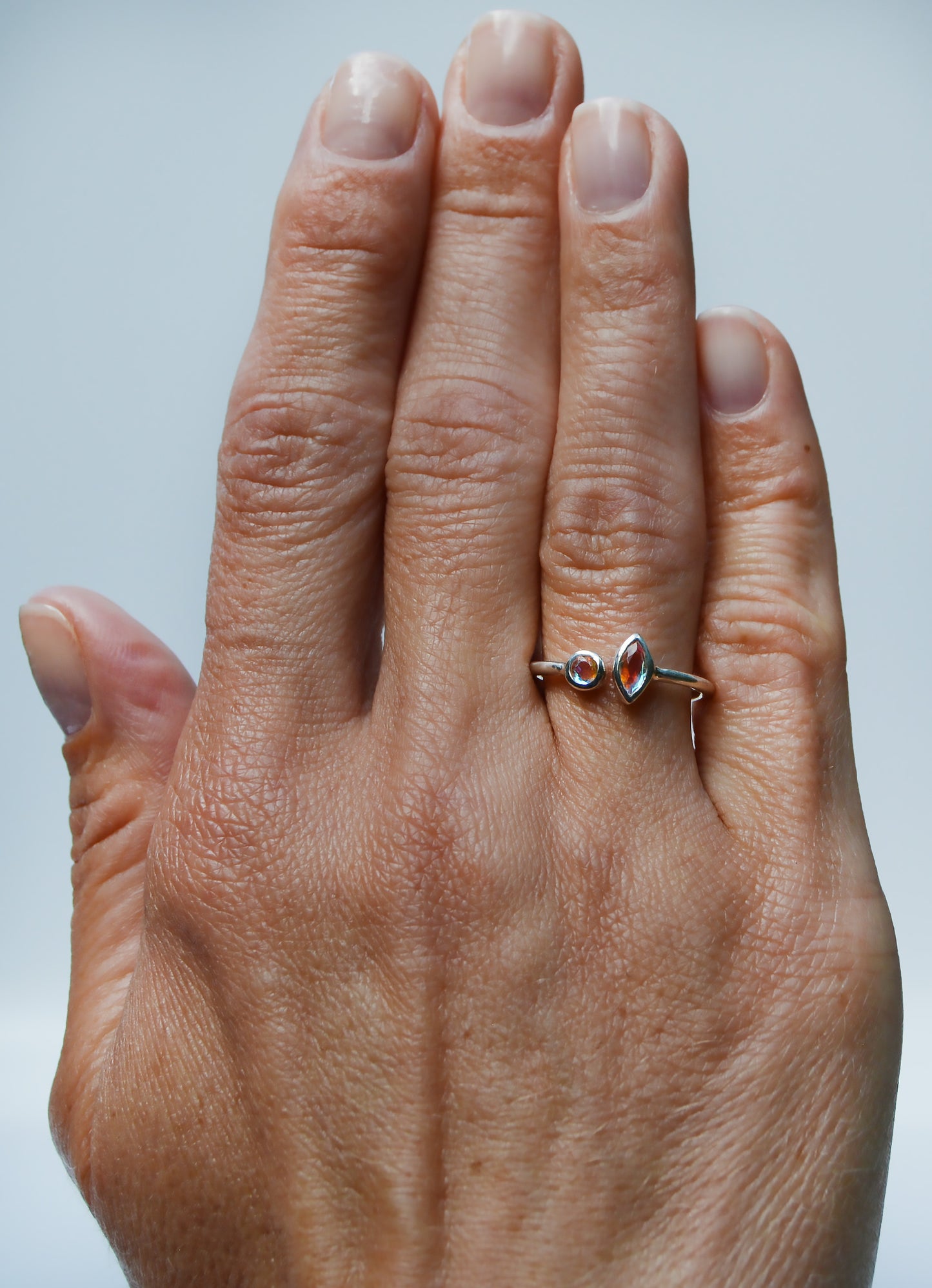 JeniMarie Jewelry with a fun and cool open band double stone design ring set in sterling silver. 