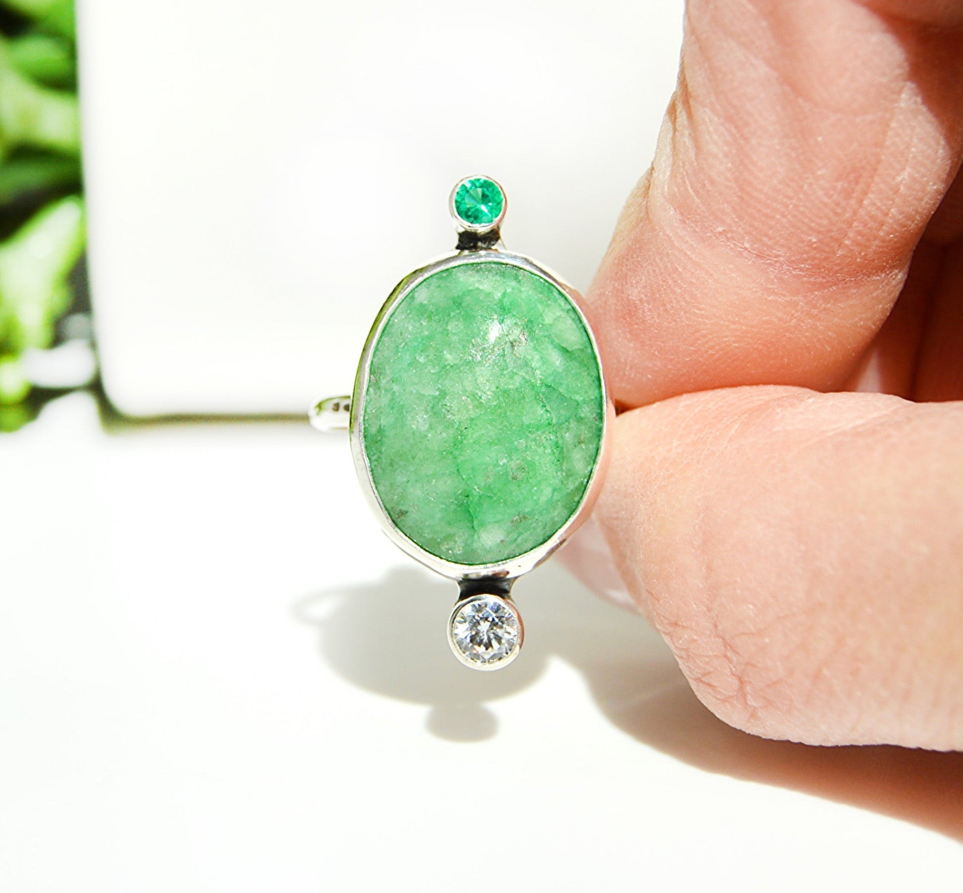 Green Emerald quartz center stone with an emerald accent tube set stone. Handmade with a fine silver bezel. JeniMarie Jewelry 