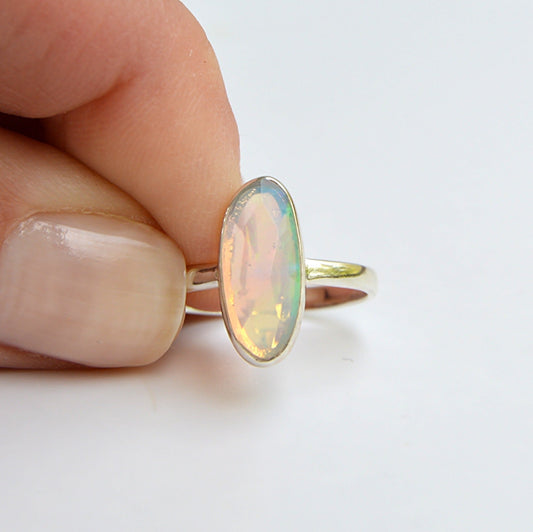JeniMarie Jewelry presents a faceted ethiopian opal set in .925 sterling silver. Comfort band and hypoallergenic. 