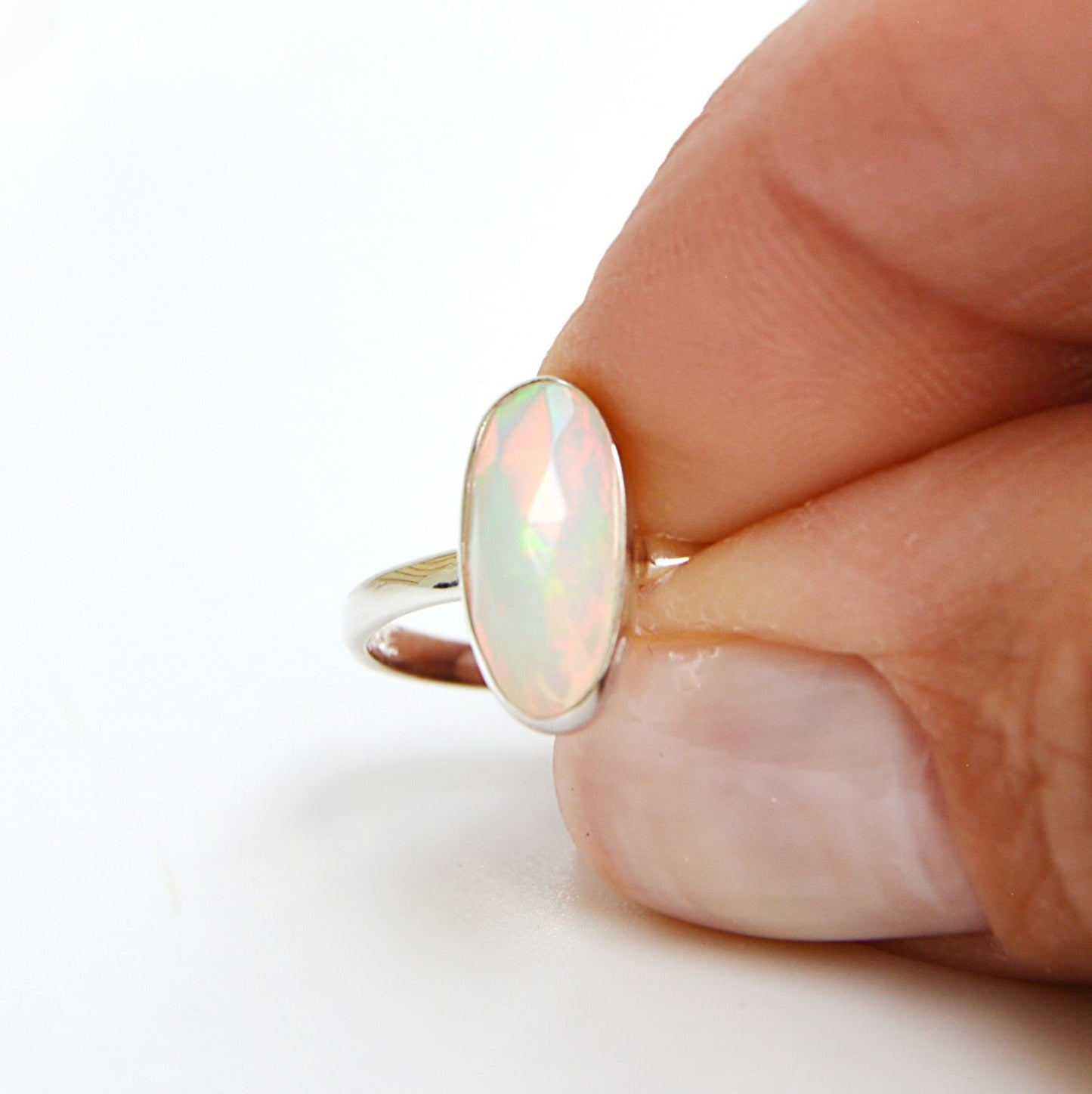 JeniMarie Jewelry features a stunning Ethiopian opal ring set in .925 sterling silver. 