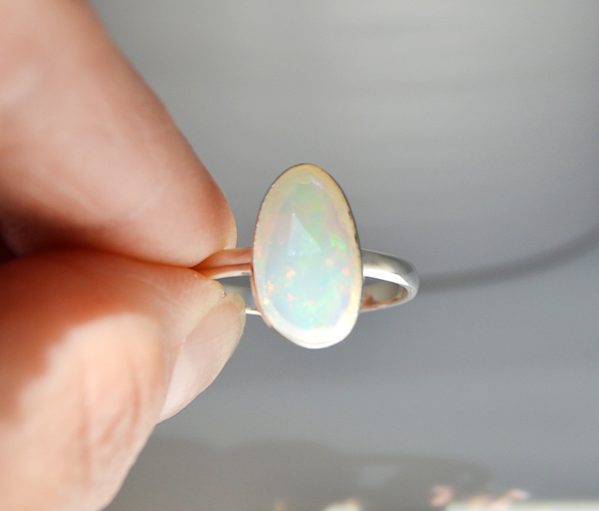 Large rare Ethiopian opal set in sterling silver. Handmade by JeniMarie Jewelry, single band ring hypoallergenic jewelry