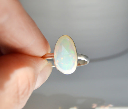 Large rare Ethiopian opal set in sterling silver. Handmade by JeniMarie Jewelry, single band ring hypoallergenic jewelry