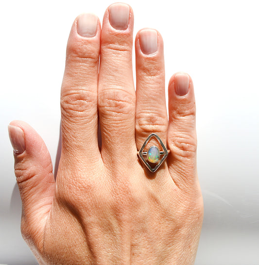 JeniMarie Jewelry hypoallergenic sterling silver ring featuring an Ethiopian Opal stone with a sterling silver accent border. 