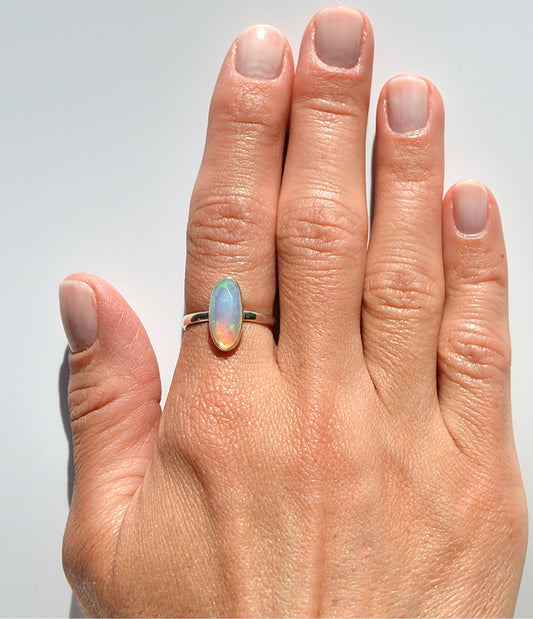 JeniMarie Jewelry with a .925 sterling silver ring. High polish for extra shine and unique rare cut ethiopian opal stone. 