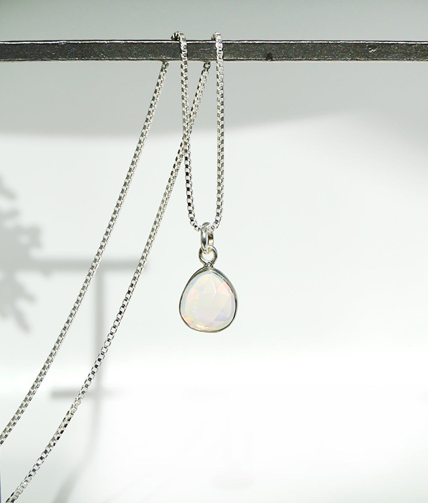 Necklace with a pendant on a light background