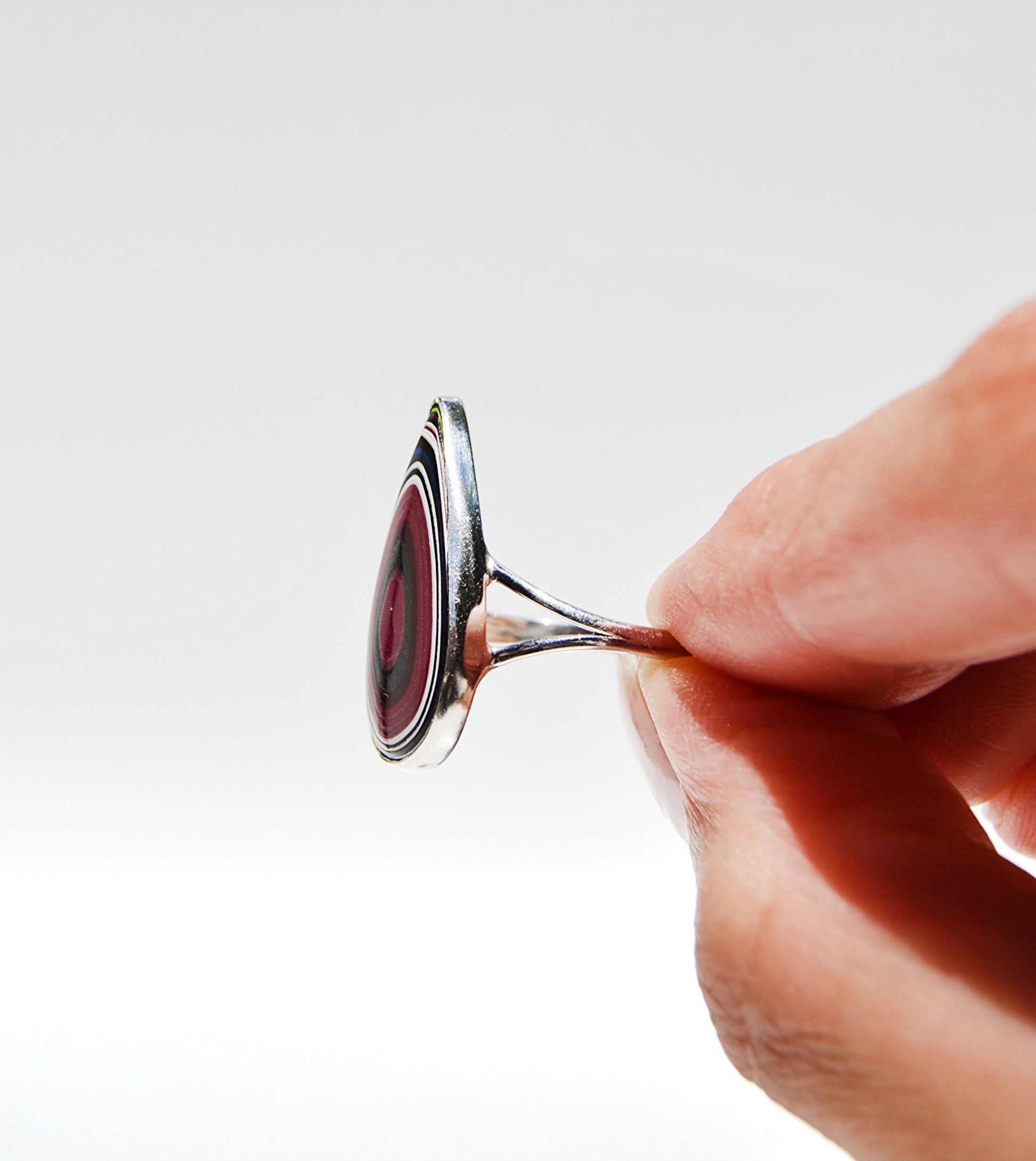 JeniMarie Jewelry with a rare and large pear shaped fordite ring set in sterling silver. 