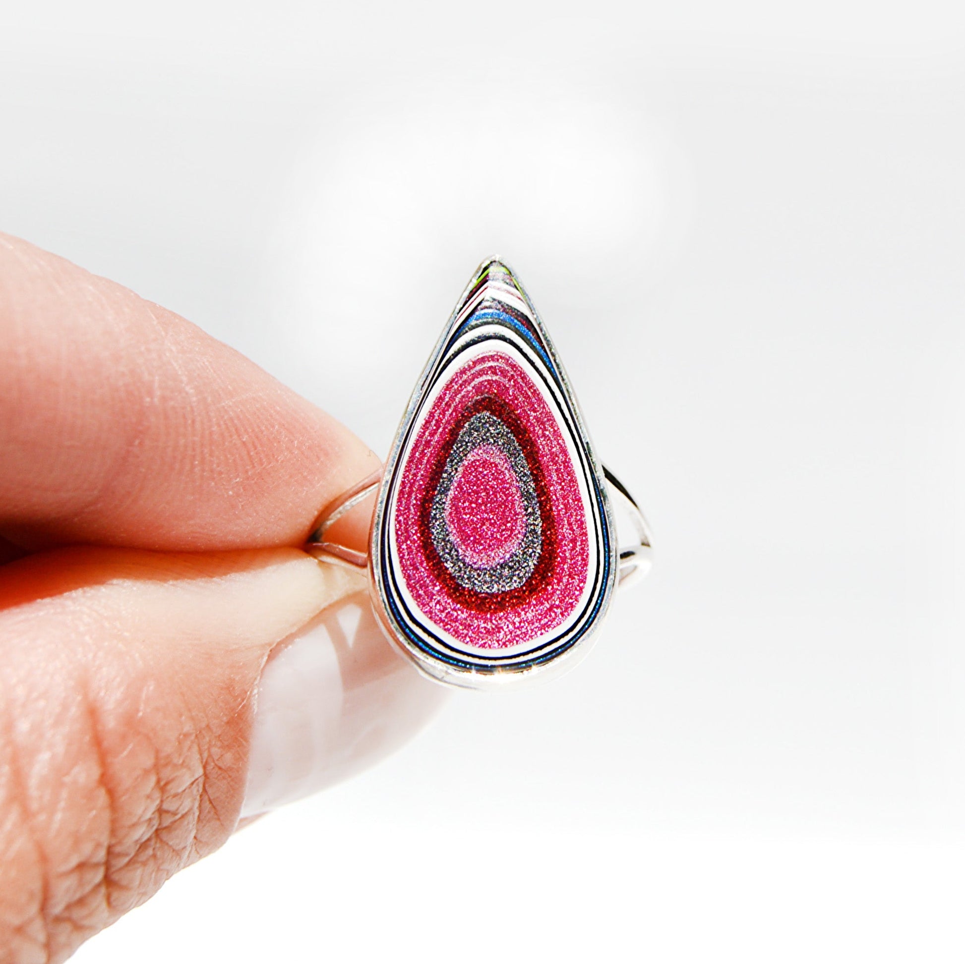 JeniMarie Jewelry with a rare and unique pear shaped fordite ring set in sterling silver. 