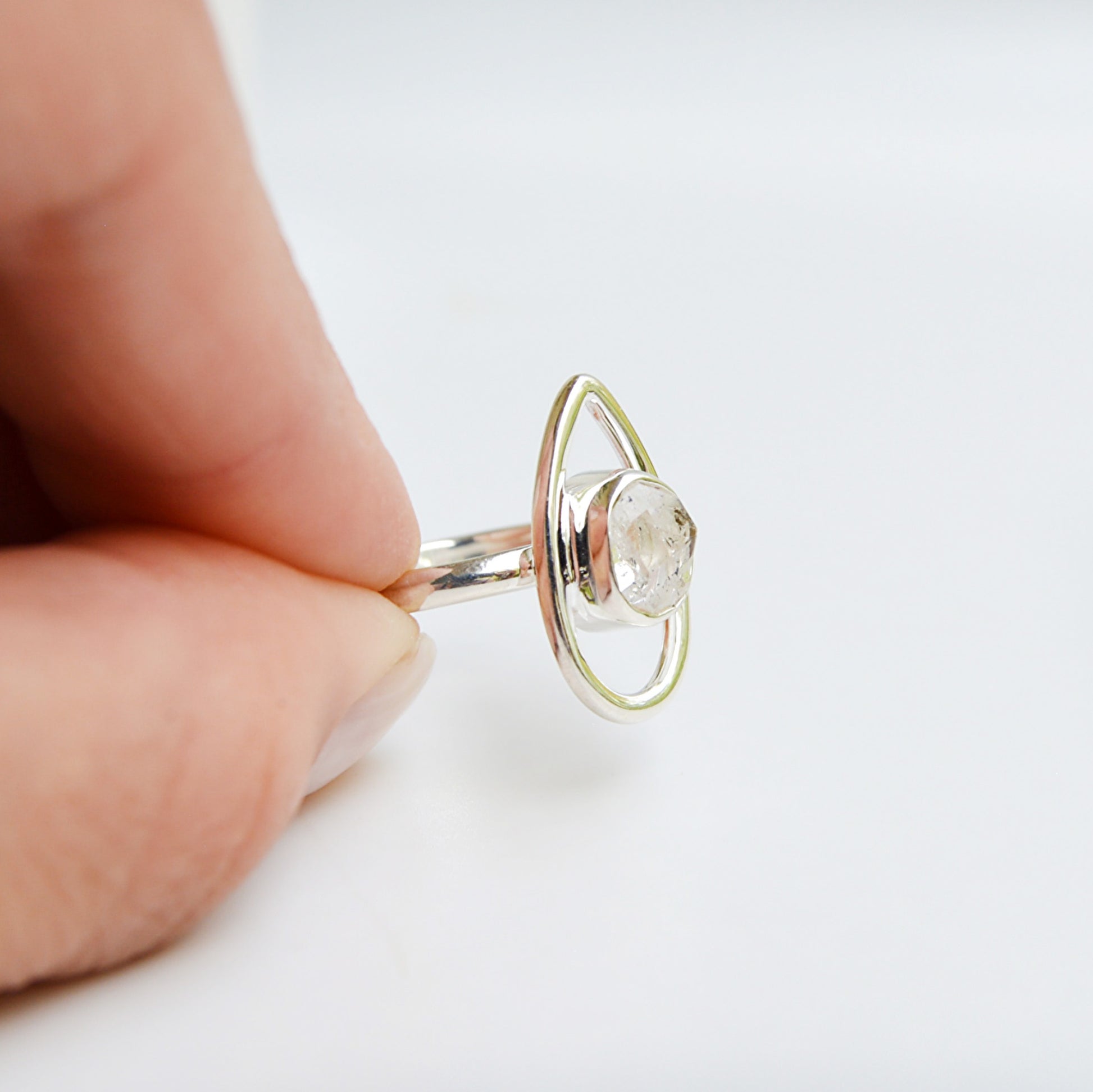 JeniMarie Jewelry features a Herkimer Diamond ring with a tube set stone design. .925 sterling silver was used to create these pieces which makes all of them hypoallergenic. 