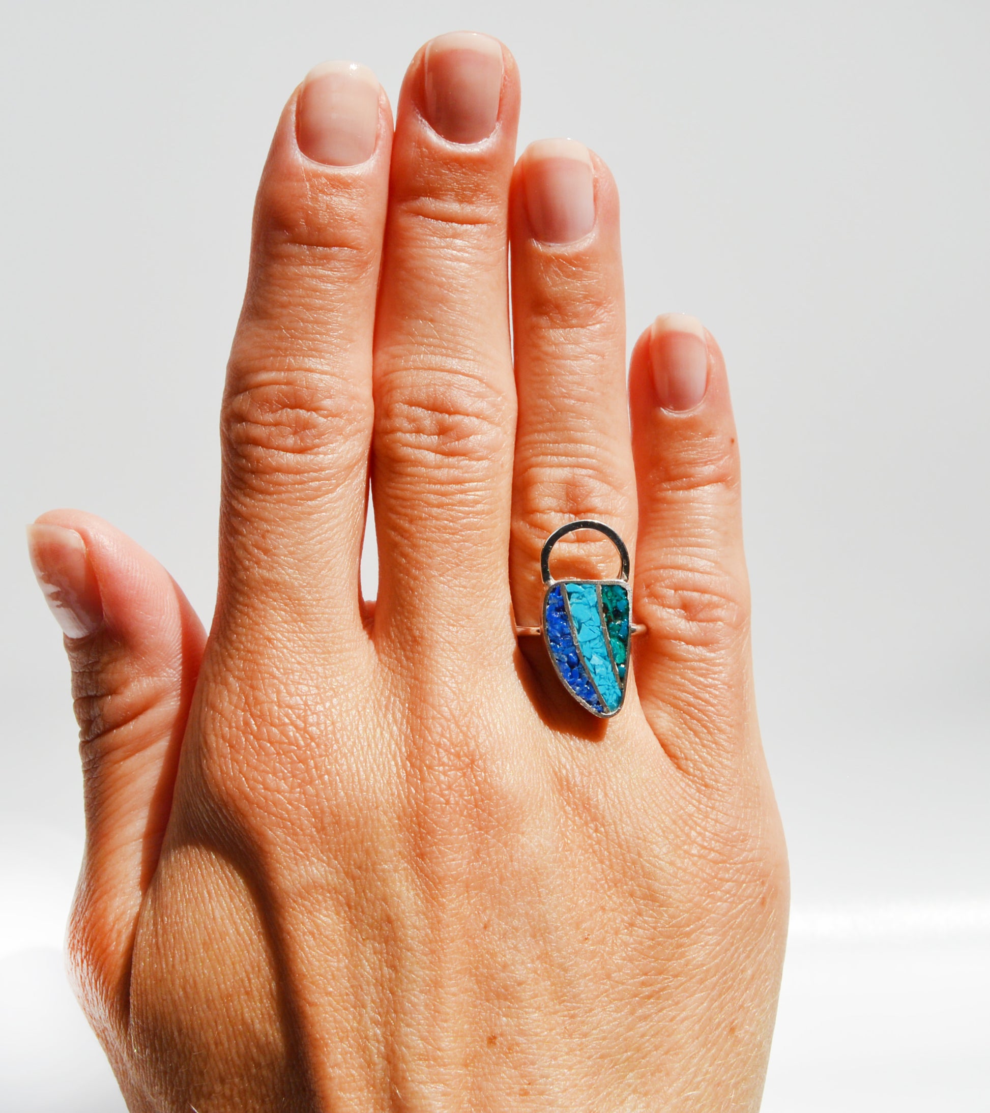 JeniMarie Jewelry with a statement ring showcasing three different color stones to create a one of a kind ring all set in sterling silver for a high polish and shine. 