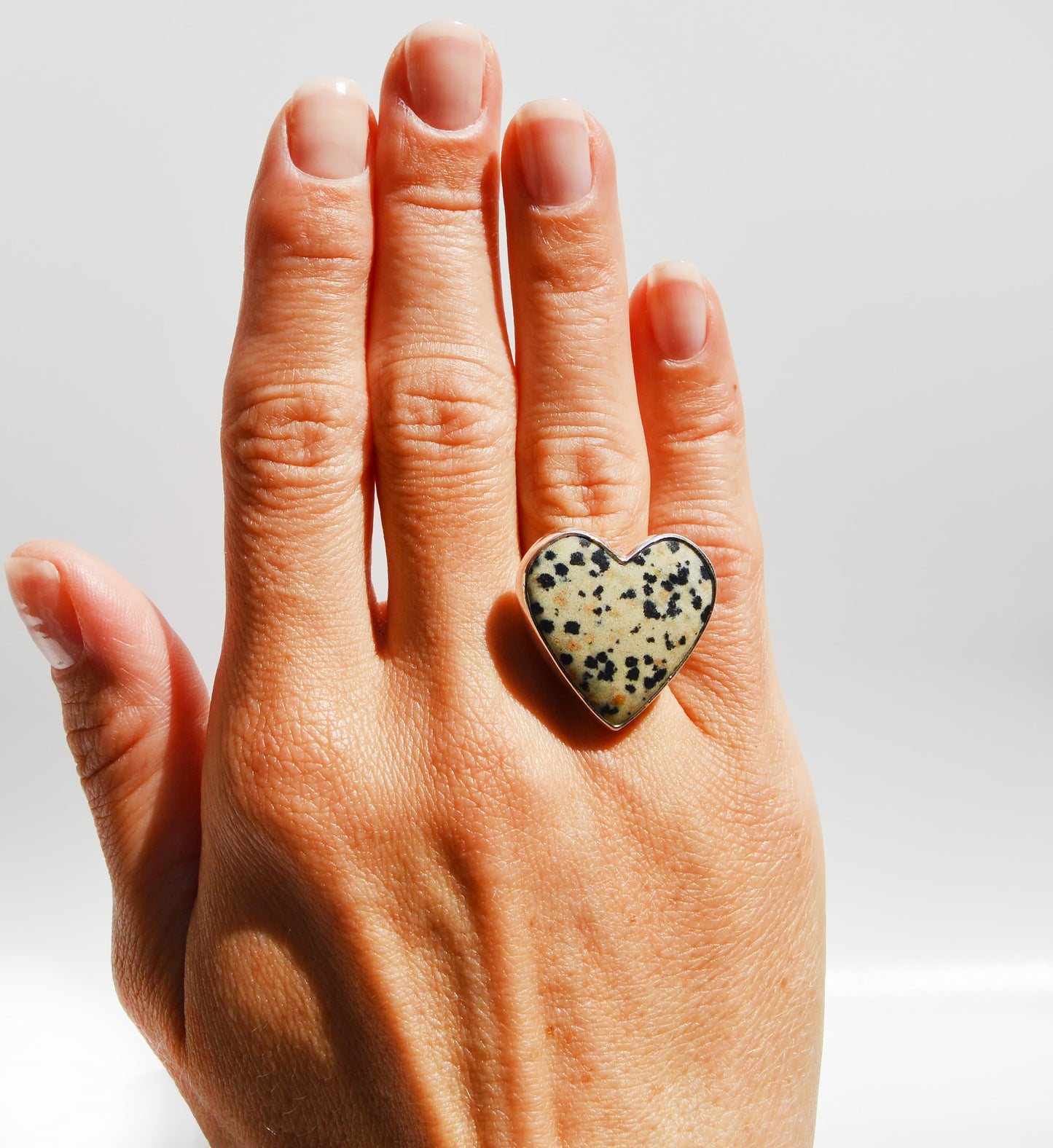 JeniMarie Jewelry with a rare and fun ring set with a dalmatian jasper stone set in sterling silver comfort band ring. 
