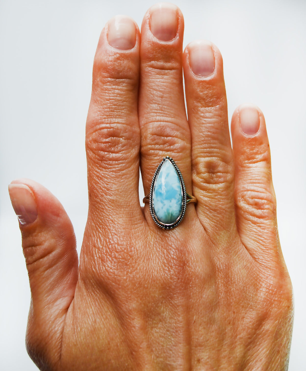JeniMarie Jewelry with a beautiful larimar stone set in sterling silver hand polished for a high shine. 