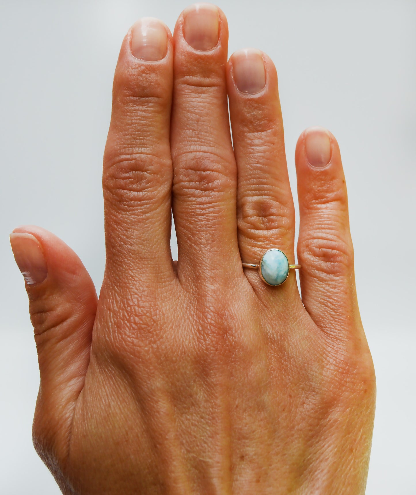 JeniMarie Jewelry with a fun and cool looking larimar ring set in sterling silver for a high shine. 