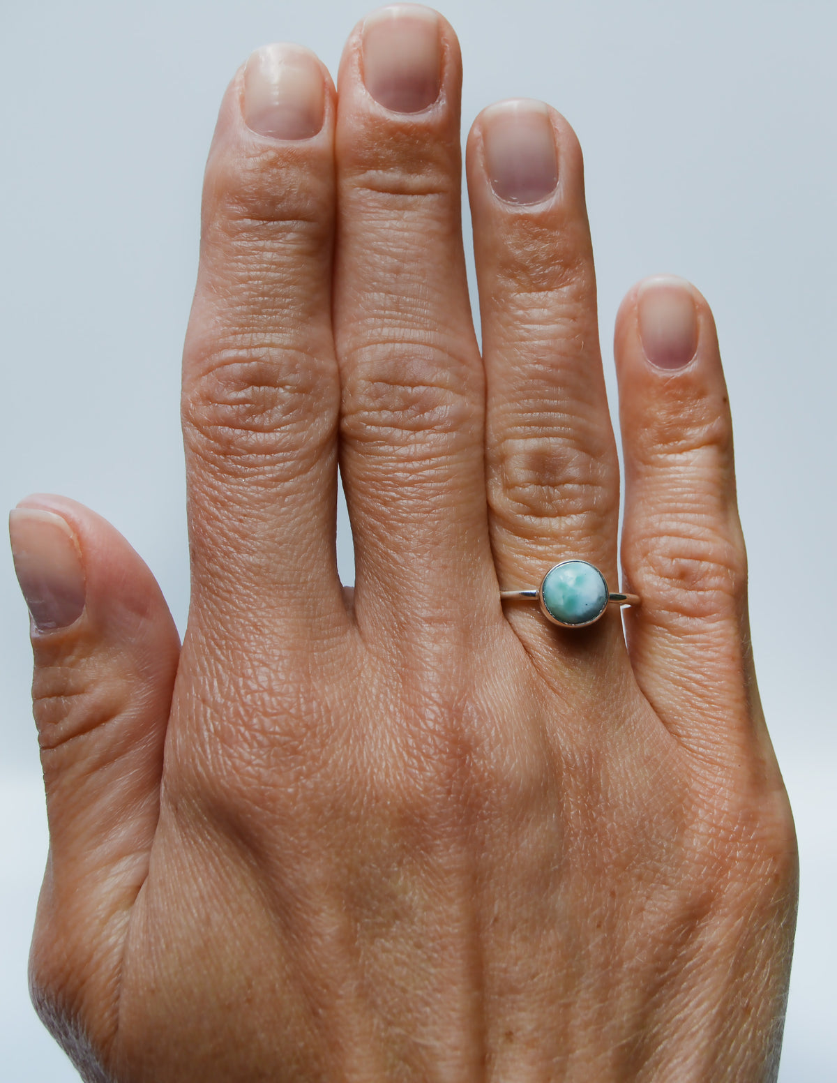 JeniMarie Jewelry with a stunning sterling silver ring featuring a larimar stone hand polished for a high shine. 