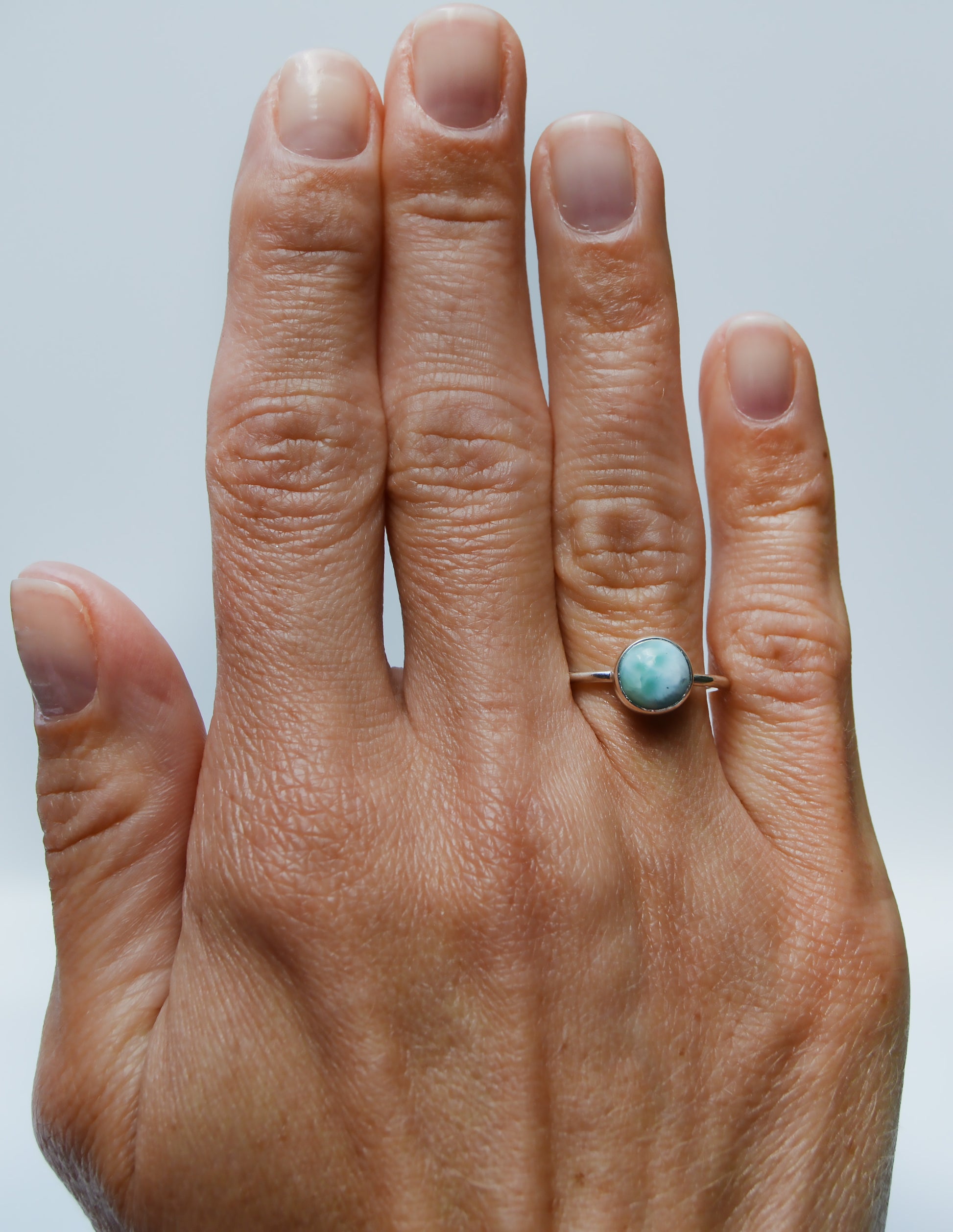 JeniMarie Jewelry with a stunning sterling silver ring featuring a larimar stone hand polished for a high shine. 