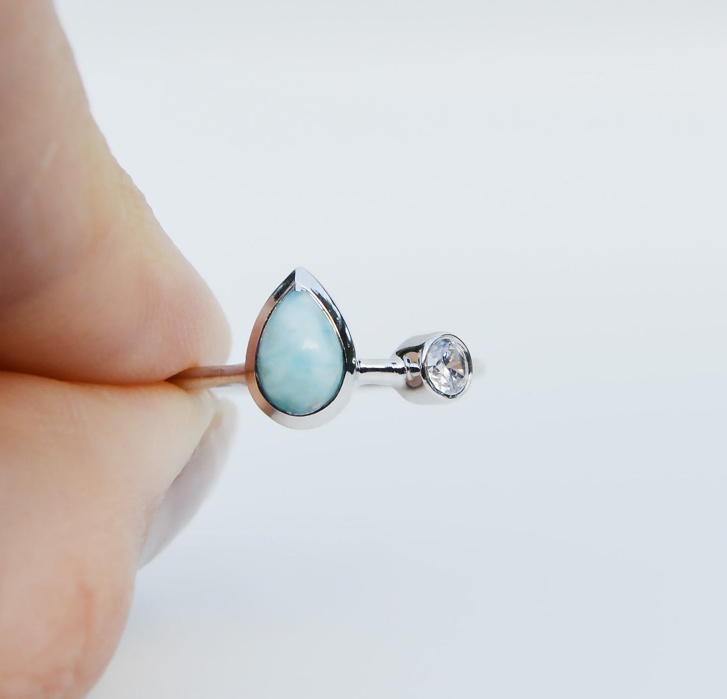 Jenimarie Jewelry with a stunning two stone ring featuring a pear shaped larimar ring all set in sterling silver. 