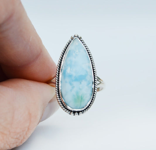 JeniMarie Jewelry with a stunning pear shaped larimar stone set in sterling silver with a beaded bezel. 