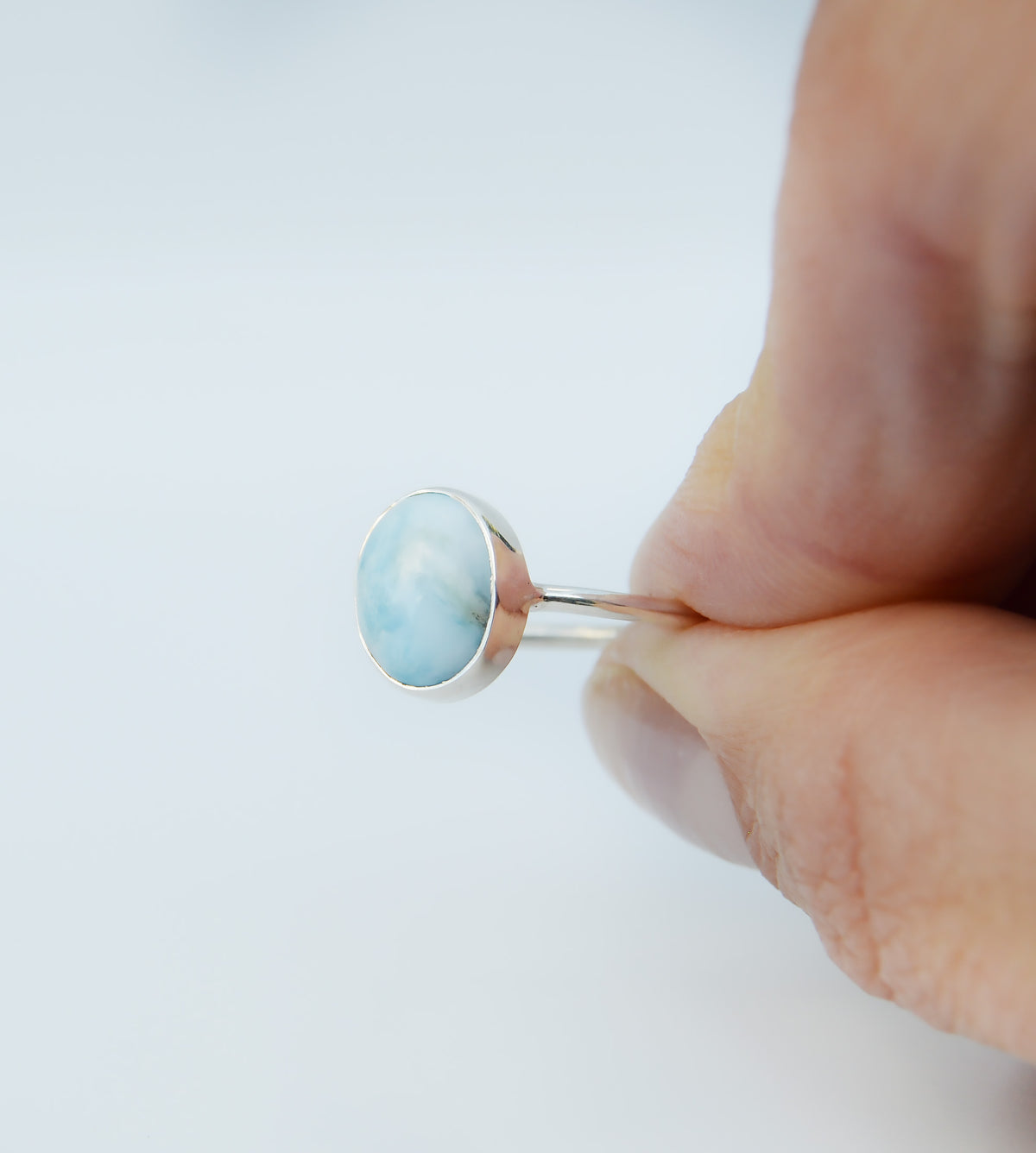 JeniMarie Jewelry with a beautiful larimar ring set in sterling silver hand set and hand polished for a high shine. 