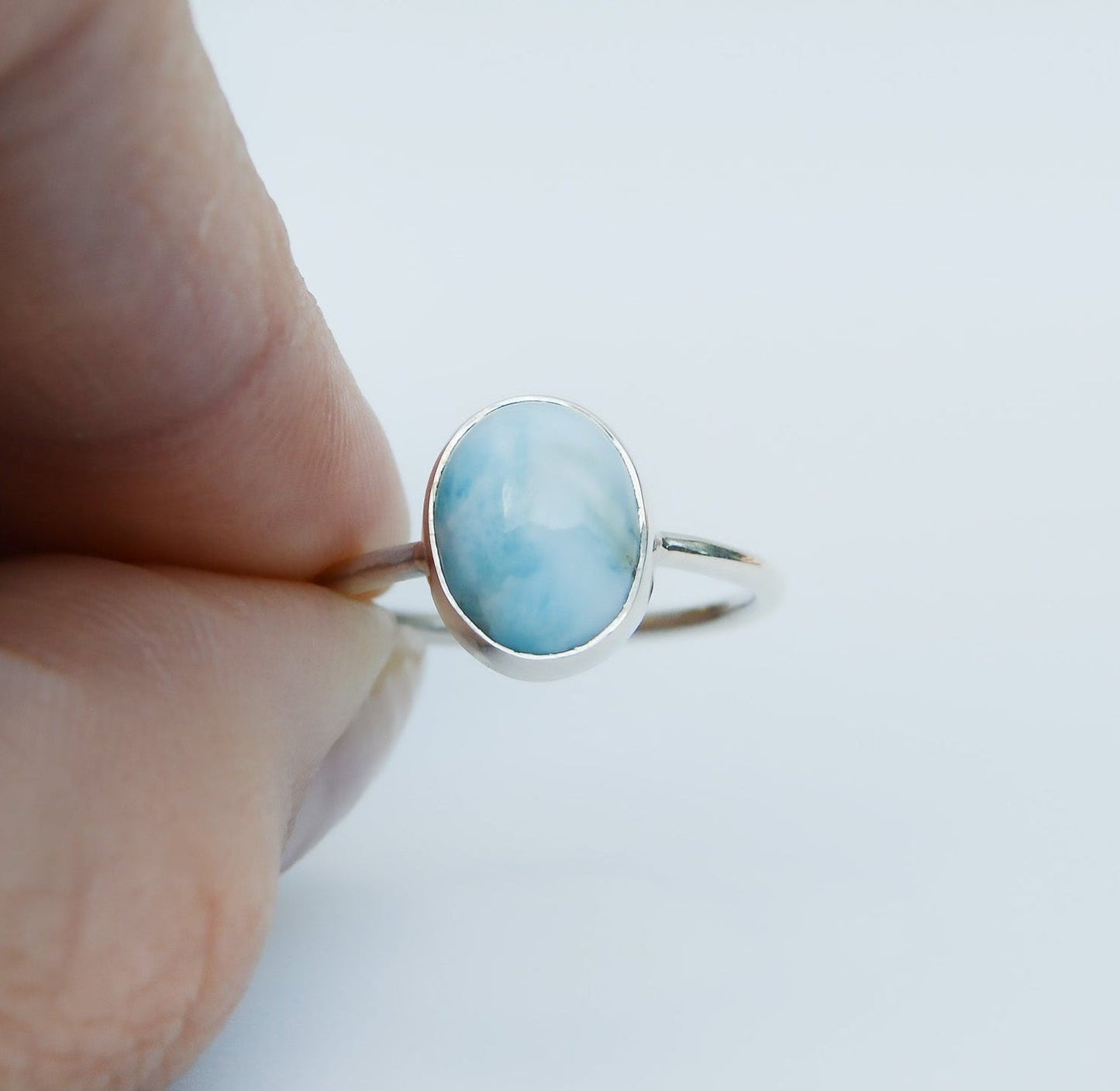 JeniMarie Jewelry with a soft blue oval larimar stone set in sterling silver. 