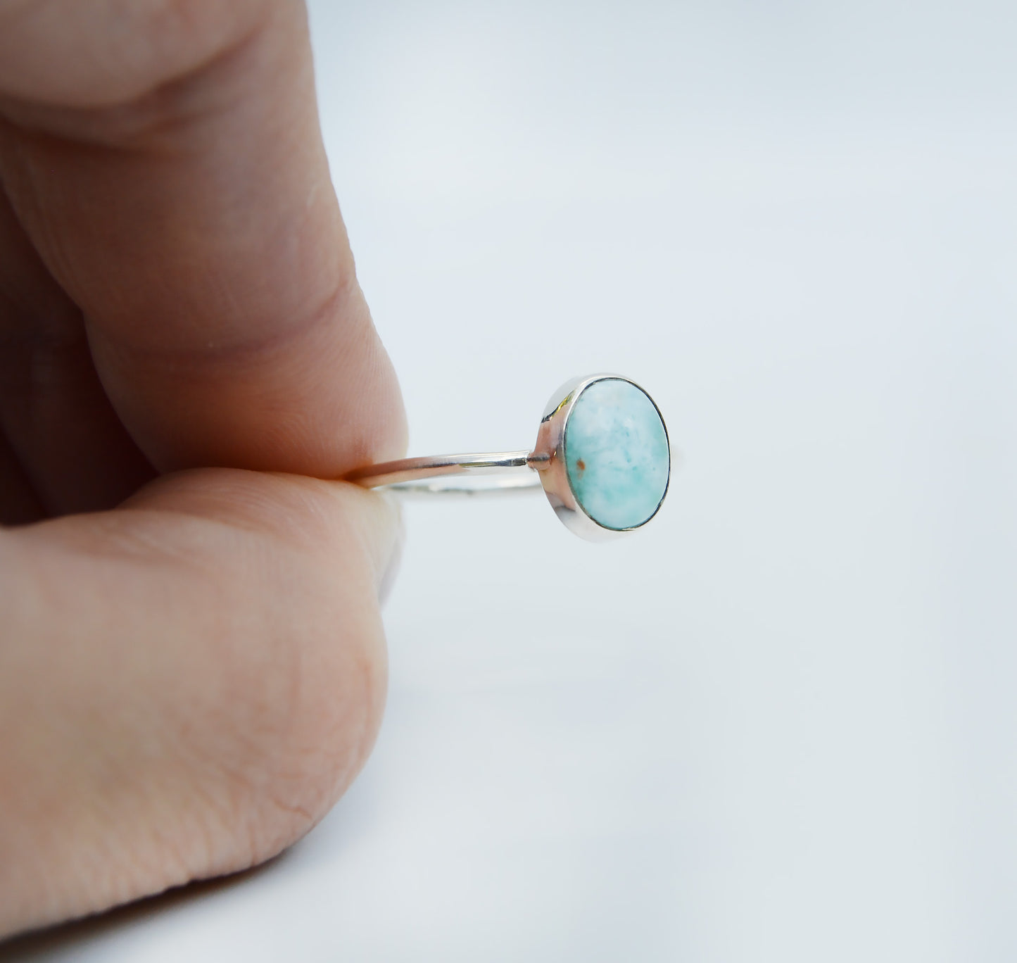 JeniMarie Jewelry with a oval cloud blue larimar stone set in sterling silver. 