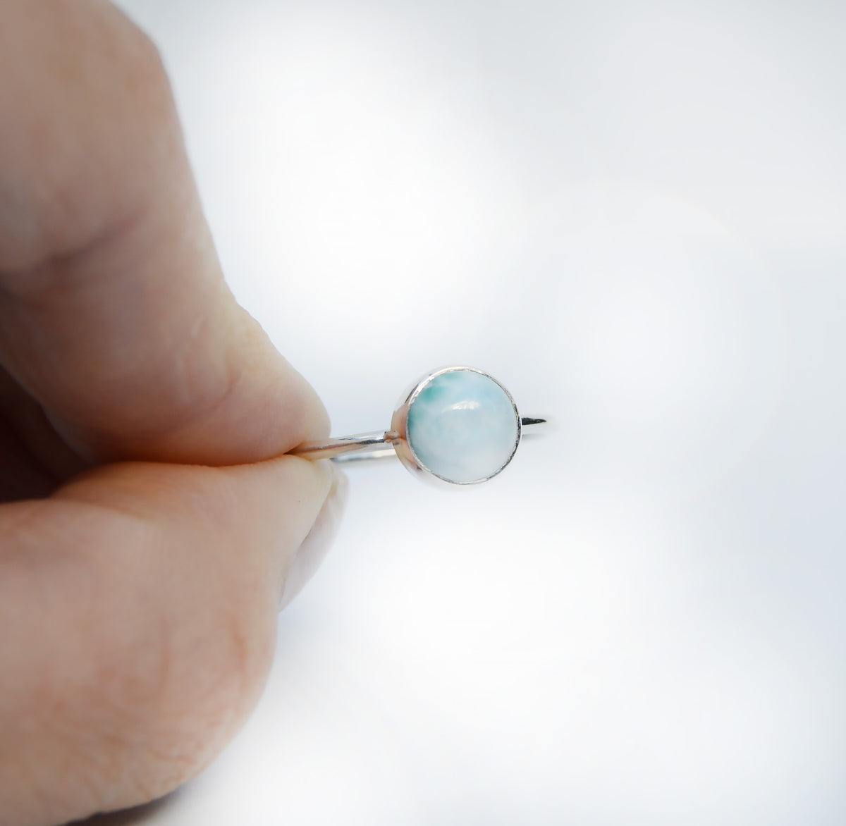 JeniMarie Jewelry with a 7mm round soft blue larimar stone set in sterling silver. 