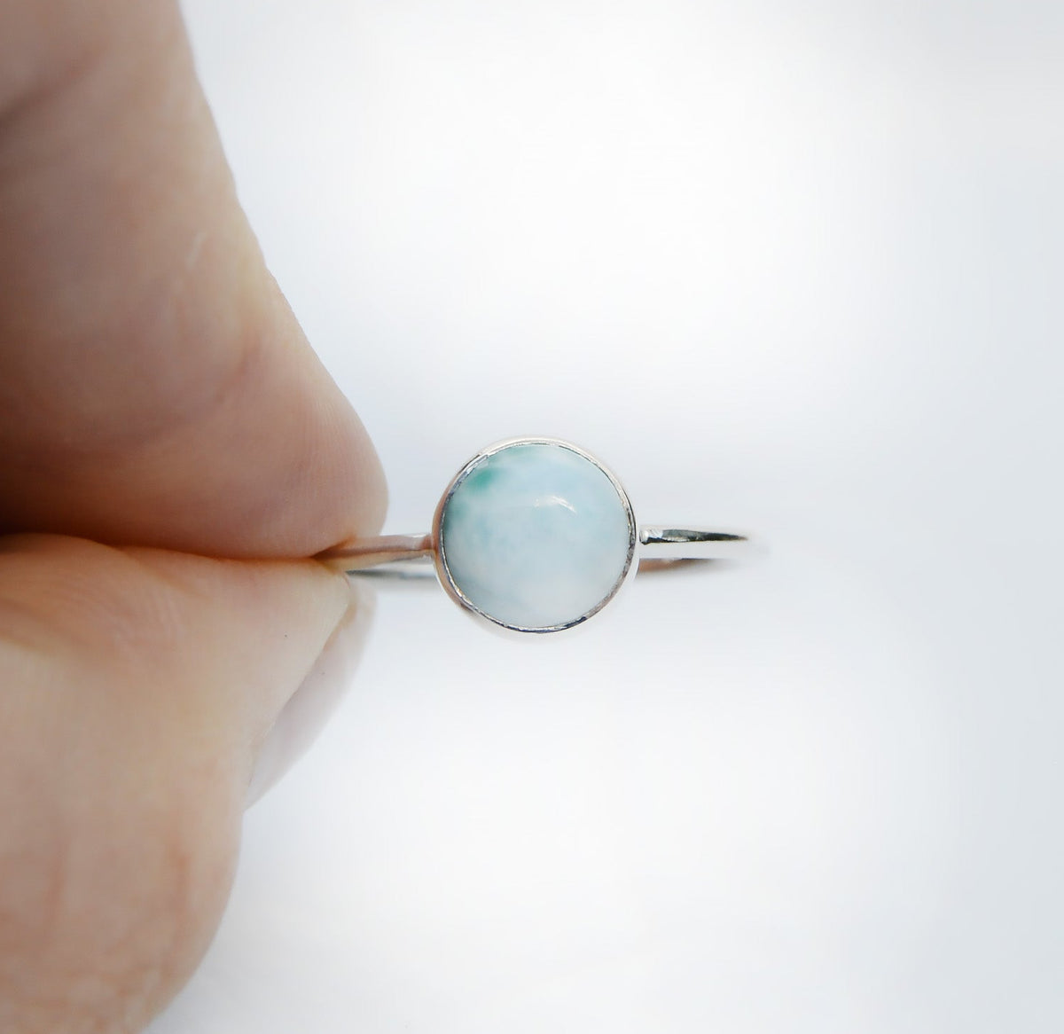 JeniMarie Jewelry with a soft blue round Larimar stone ring set in sterling silver. 