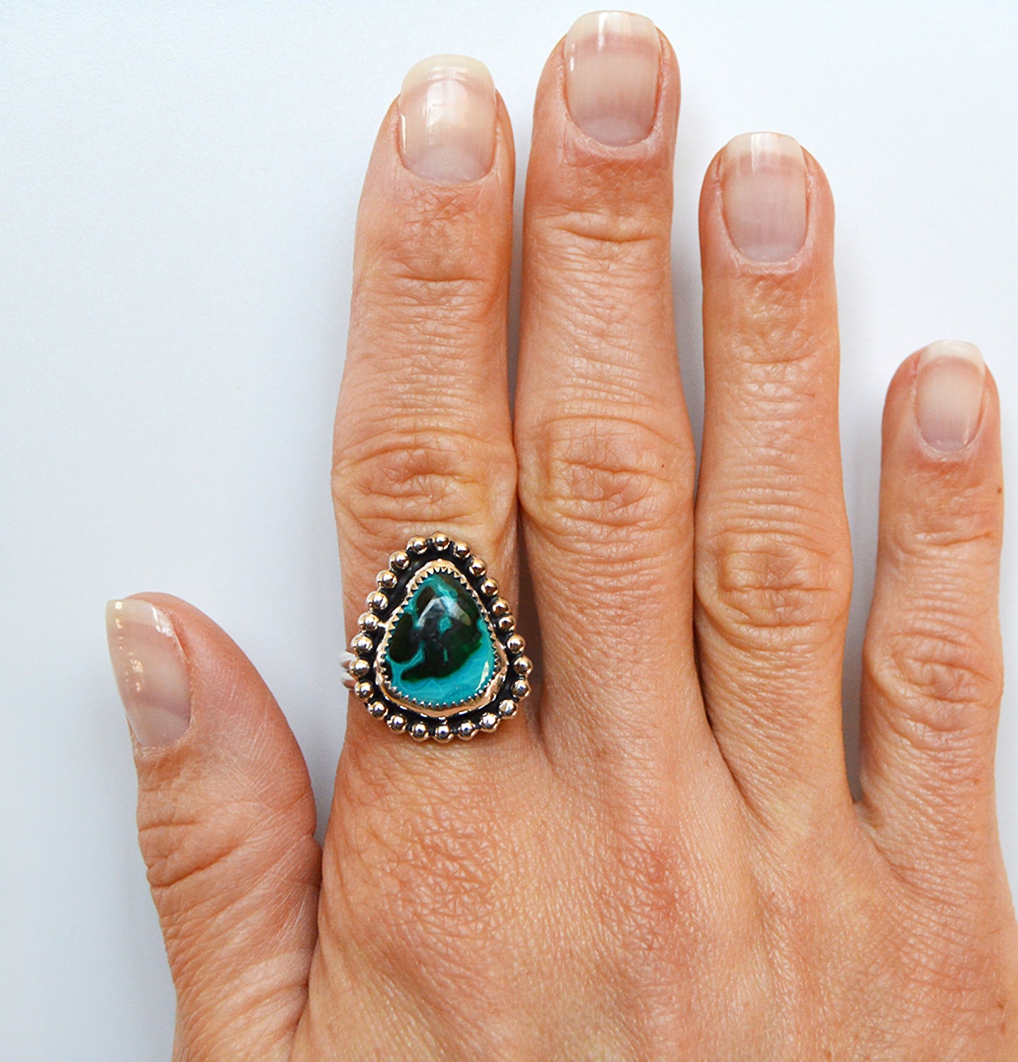 Unique and custom ring using a malaholla stone and using a fine silver bezel and sterling silver band. 